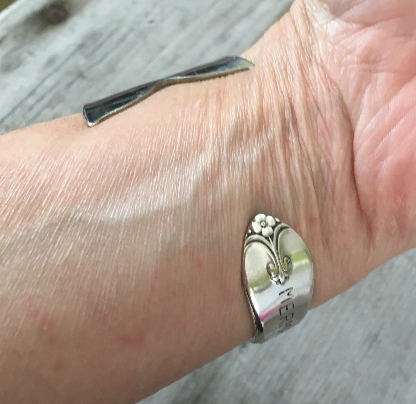 Mermaid Soul Upcycled Silverware Spoon Cuff Bracelet shown on model wrist
