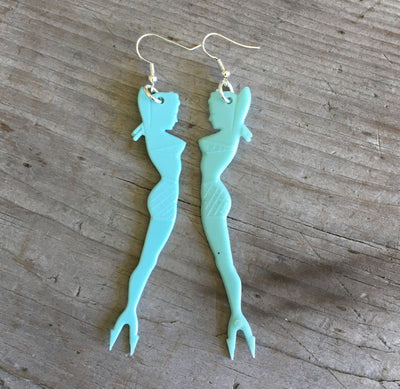 Vintage pinup mermaid swizzle stick earrings showing double-sided design with forked tail, 3.5 inches long