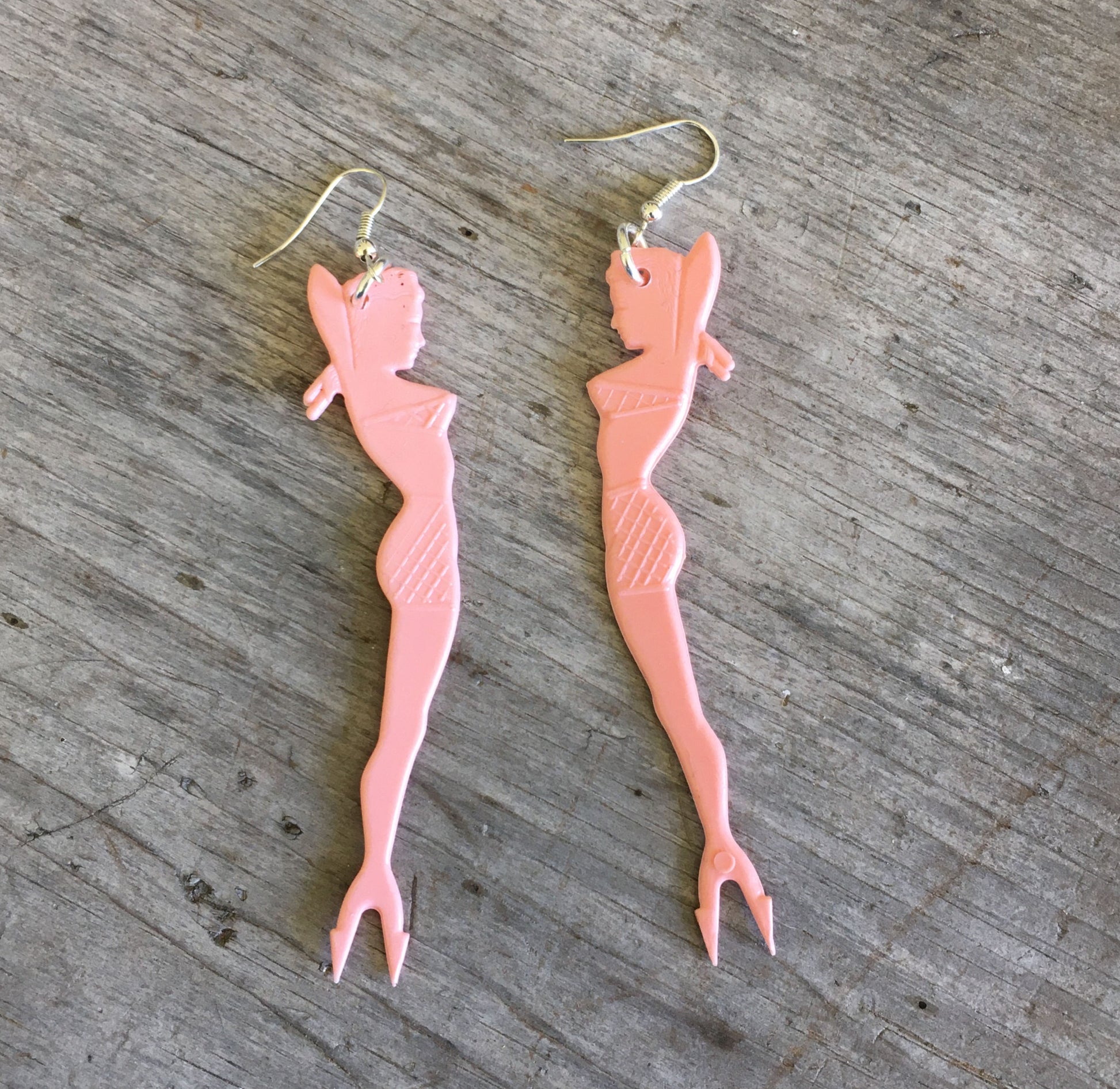 Pink pinup girl swizzle stick earrings from 1950s showing funky retro mermaid charm
