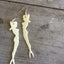 White pinup mermaid cocktail fork earrings with vintage scale detail and forked tail design