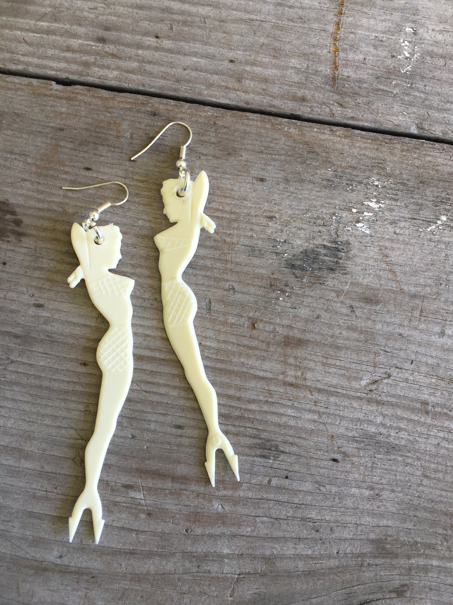 White pinup mermaid cocktail fork earrings with vintage scale detail and forked tail design