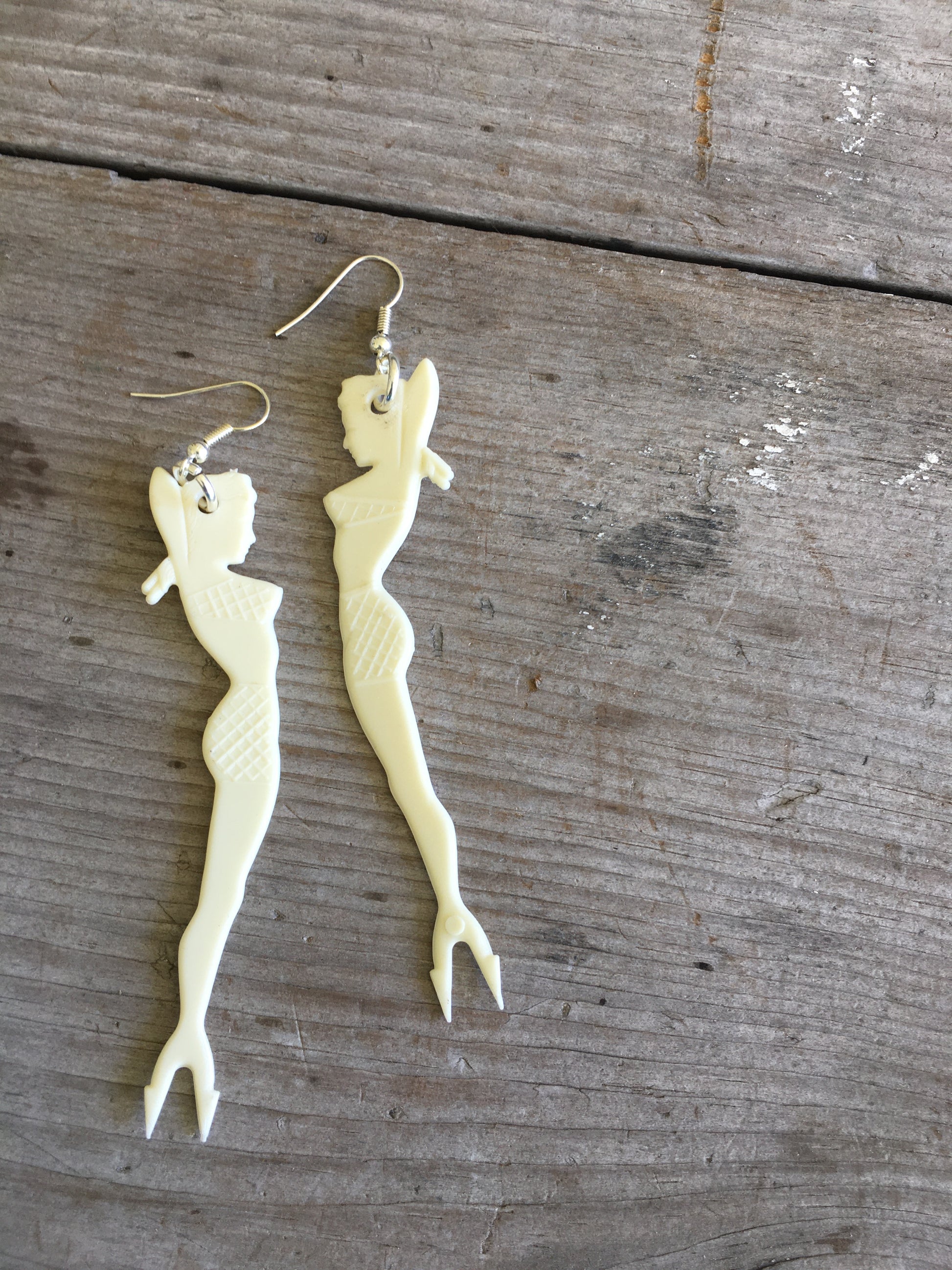 White pinup mermaid cocktail fork earrings with vintage scale detail and forked tail design