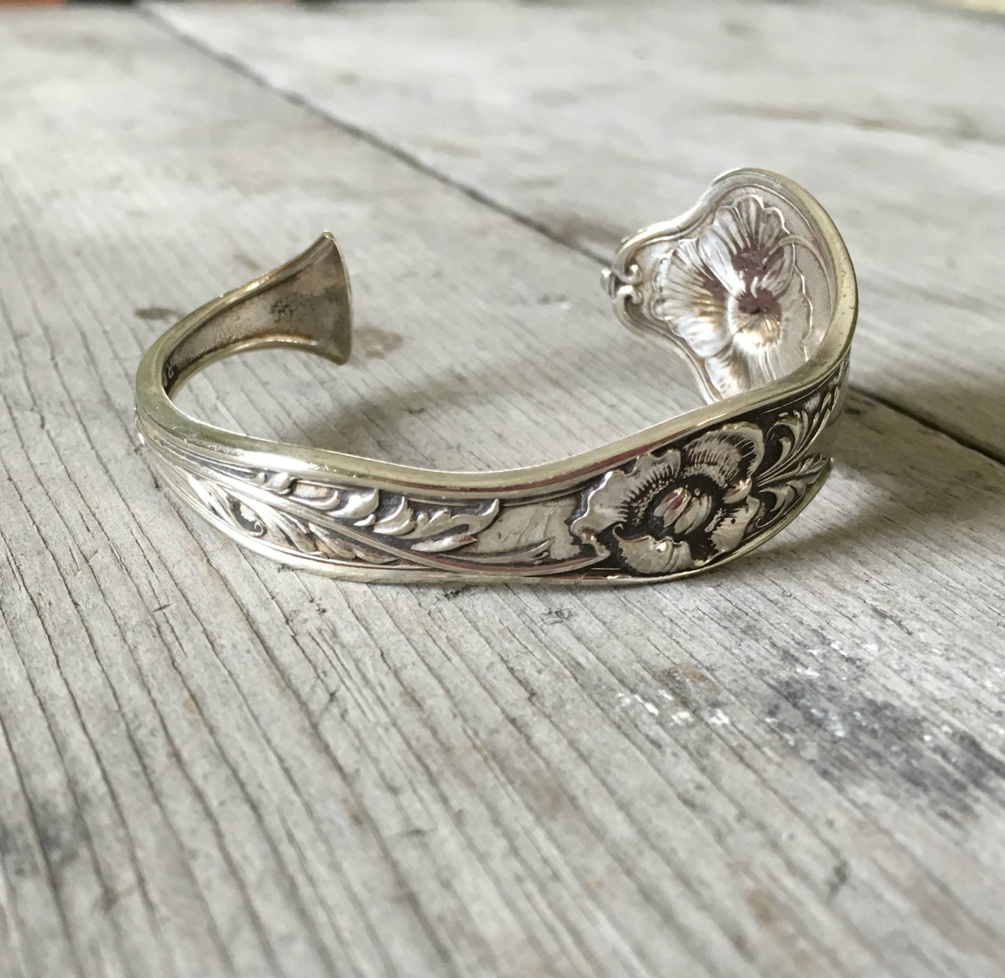 Reed and Barton Poppy pattern cuff bracelet side view showing floral detail - handcrafted from upcycled vintage silverware - Laughing Frog Studi
