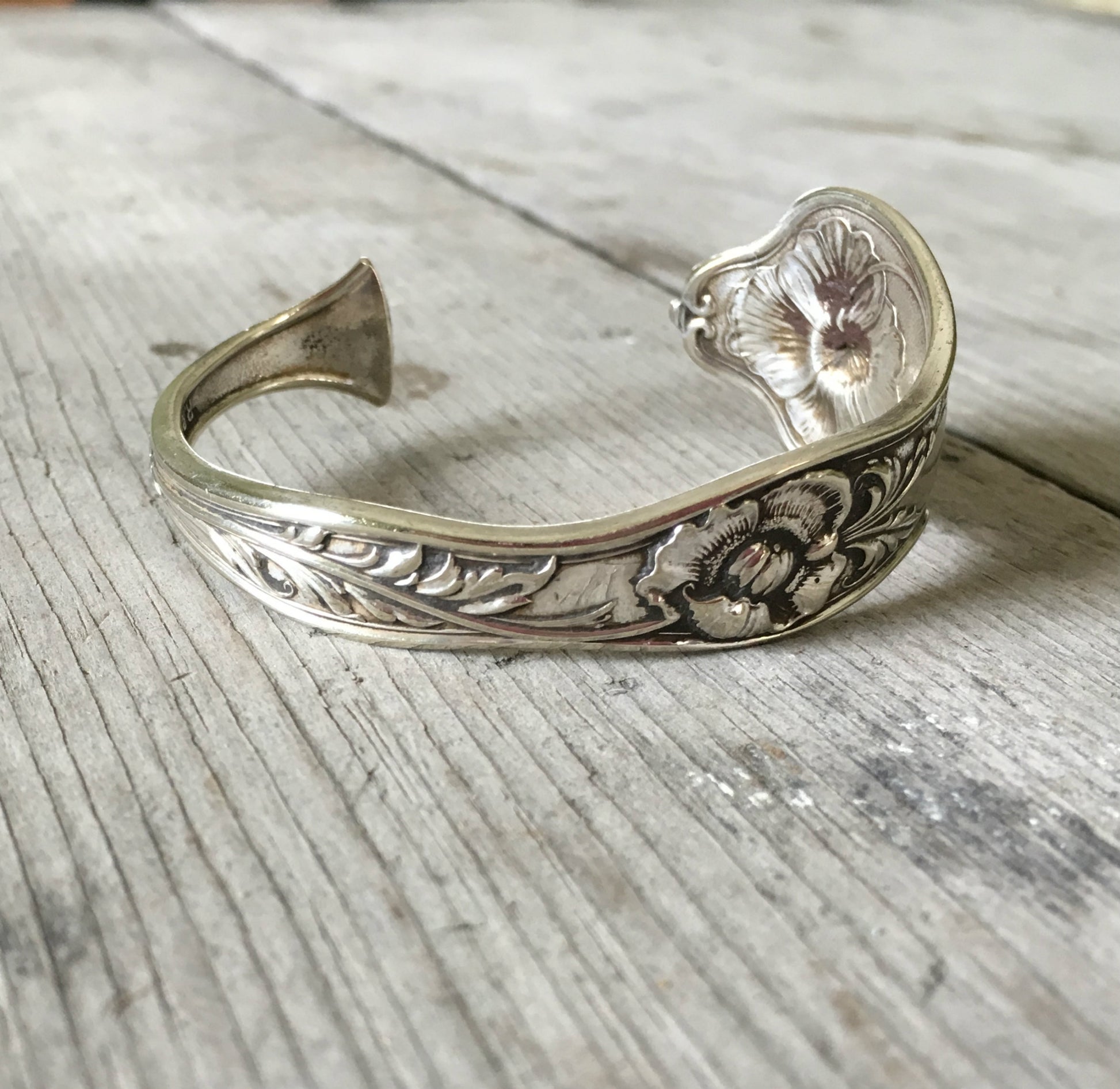 Reed and Barton Poppy pattern cuff bracelet side view showing floral detail - handcrafted from upcycled vintage silverware - Laughing Frog Studi