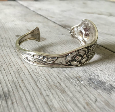 Reed and Barton Poppy pattern cuff bracelet side view showing floral detail - handcrafted from upcycled vintage silverware - Laughing Frog Studi