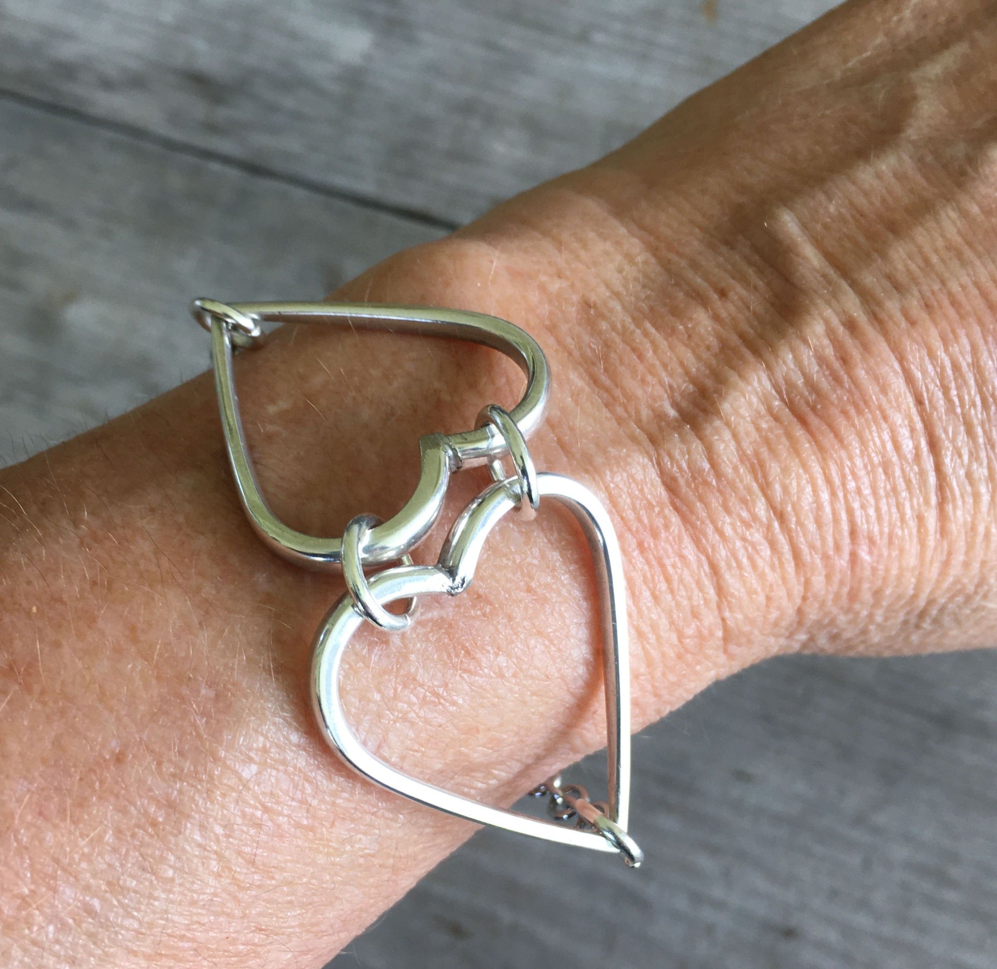 Relationship Hearts Upcycled Silverware Bracelet for Valentines Day Shown on Model