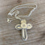 Back of Handmade Cross Necklace Made from upcycled silverware handles 