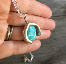 Silverware Necklace from Scrap Piece and Turquoise Colored Stone shown in hand for scale