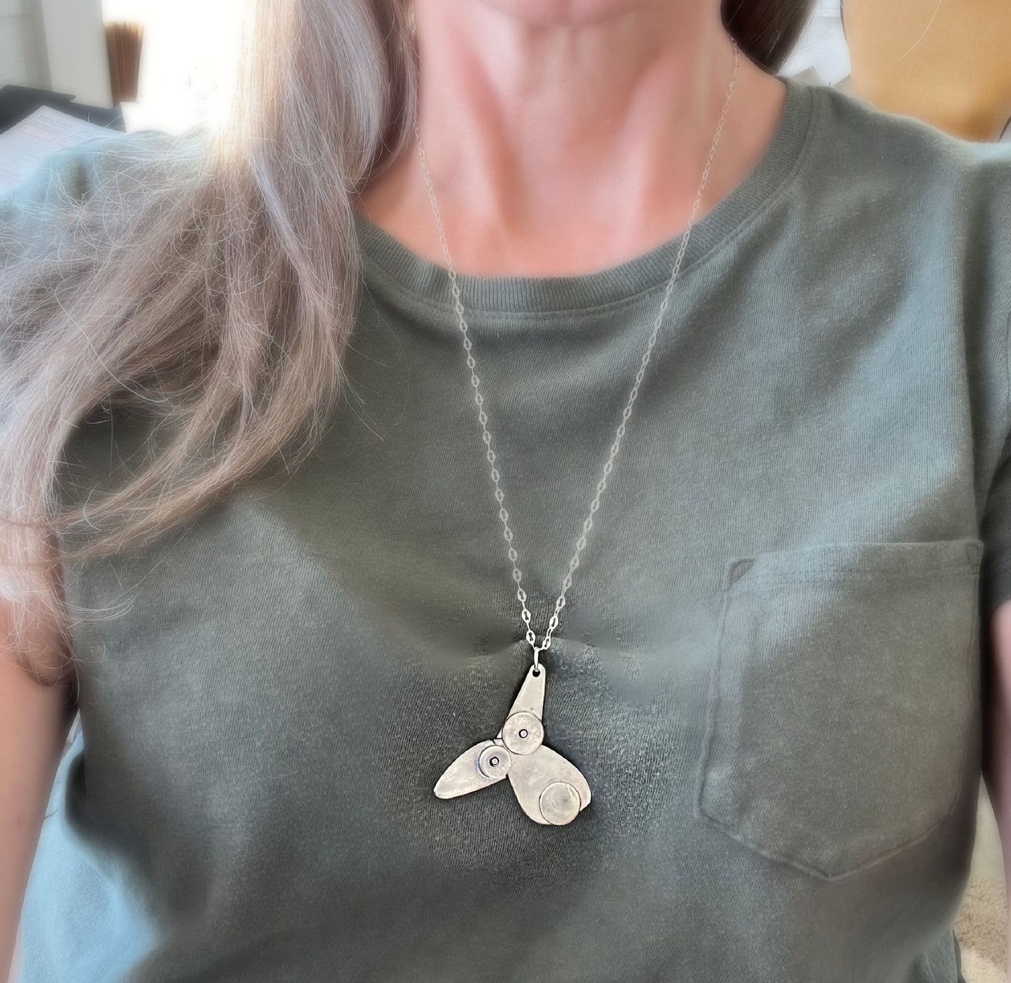 Vintage silverware puppy necklace shown on model - handmade artisan dog jewelry