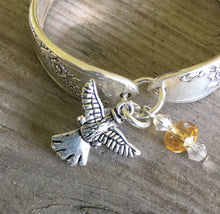 Close Up of Angel Charm on Spoon Bracelet with Angel Charm and Glass Beads 