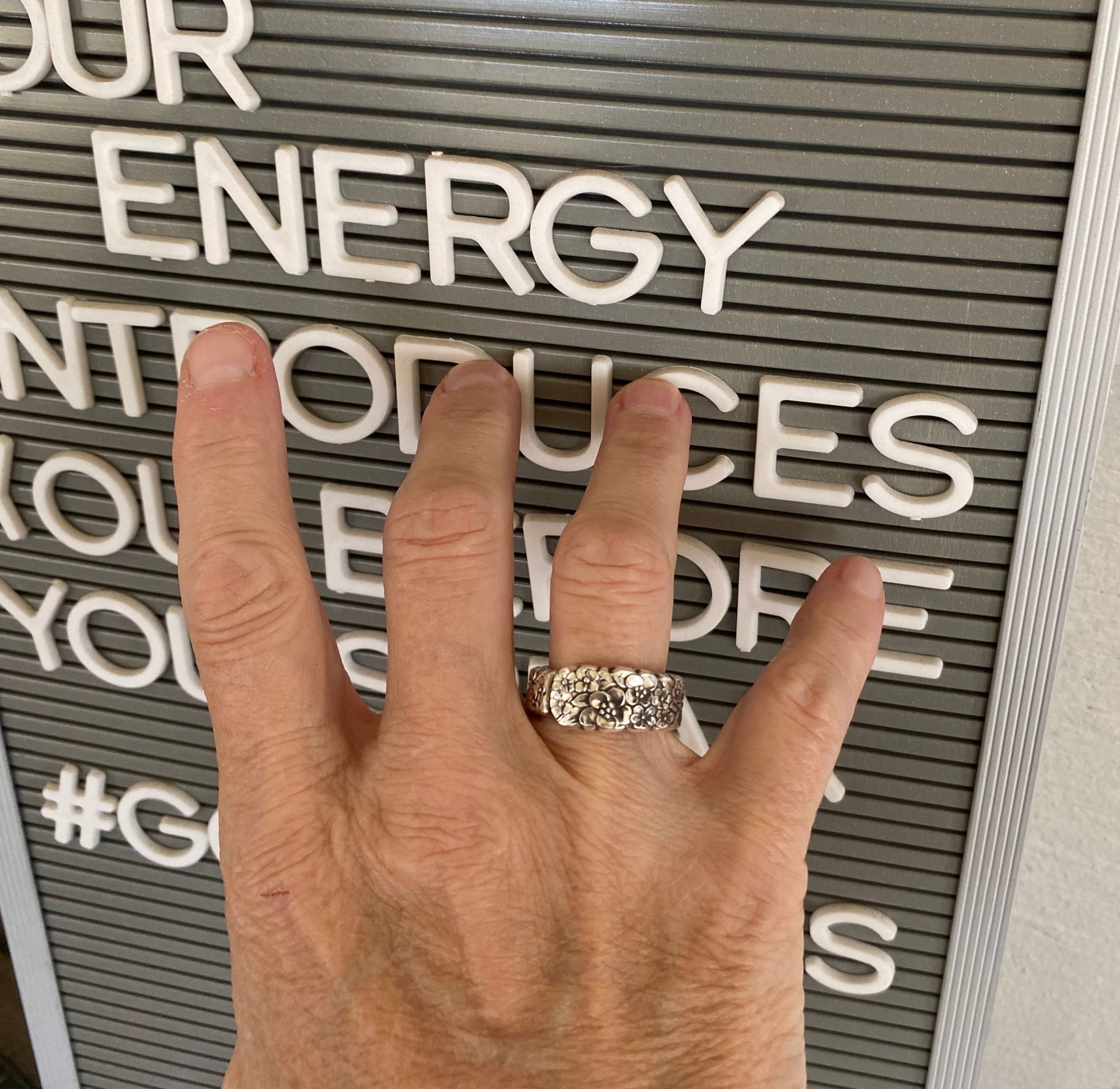 LOVE PRECIOUS FLOWER spoon ring worn on hand showing size and fit of upcycled silverware ring
