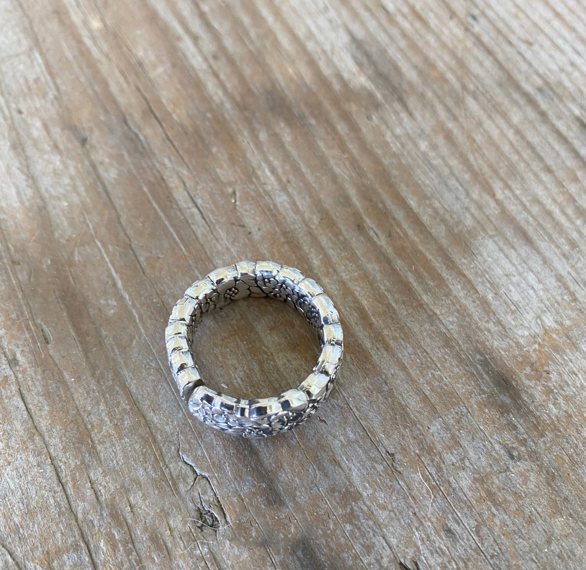 Detail of LOVE PRECIOUS FLOWER spoon ring highlighting ornate vintage silverware craftsmanship