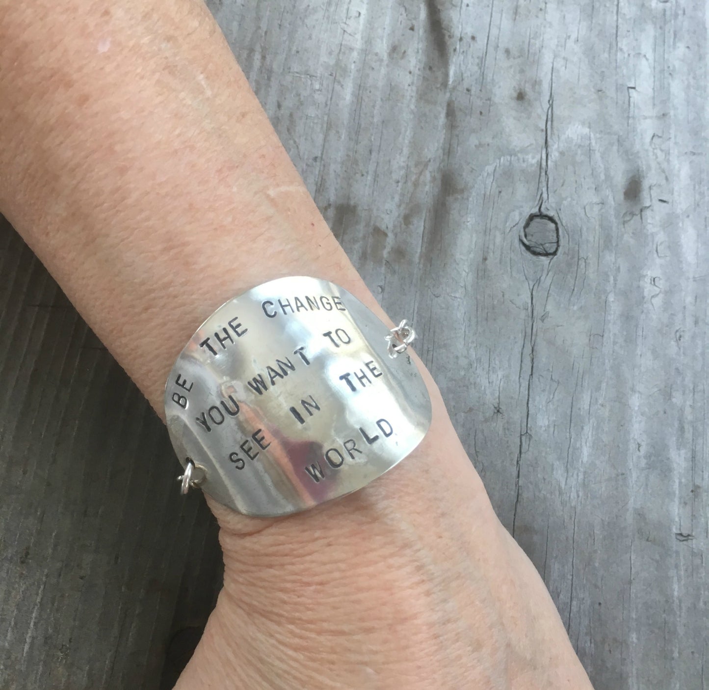 Stamped Spoon Upcycled spoon bracelet shown on model wrist