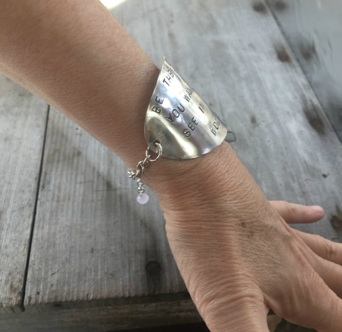 Stamped Spoon Upcycled spoon bracelet shown on model wrist