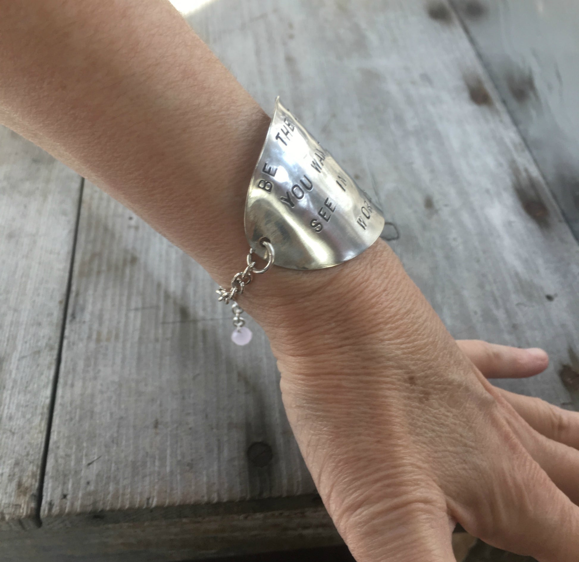 Stamped Spoon Upcycled spoon bracelet shown on model wrist