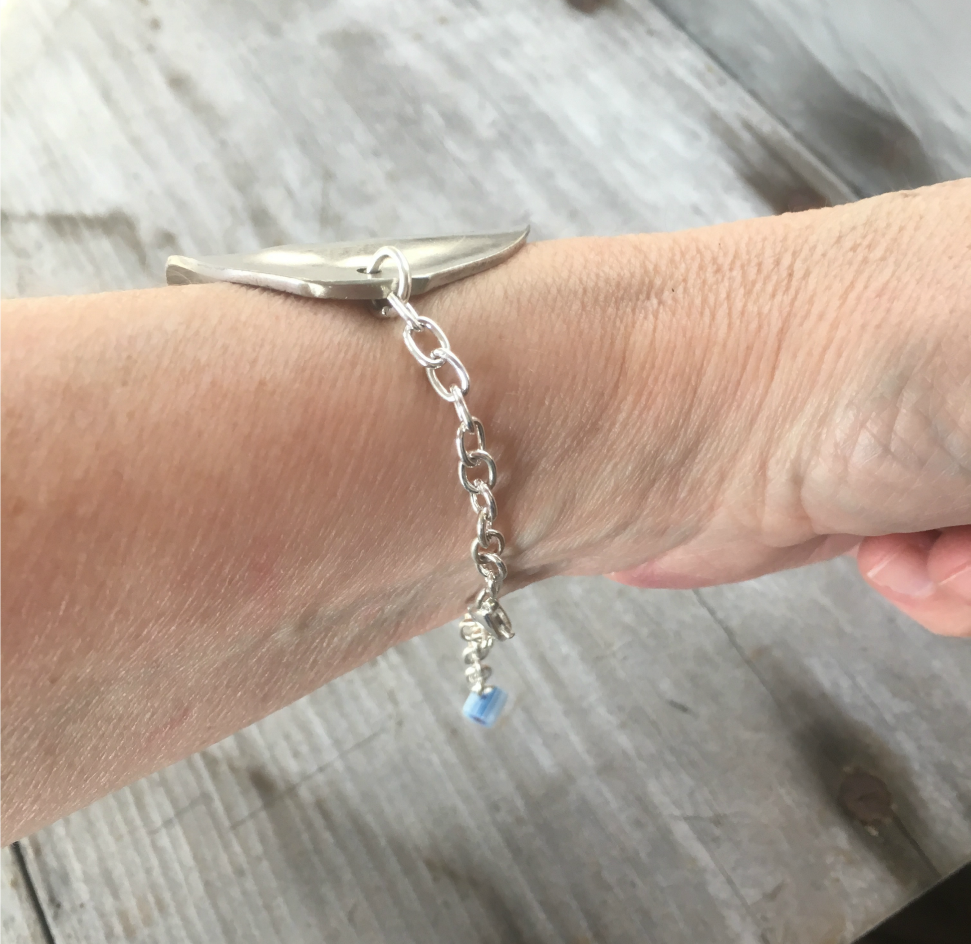 Stamped Spoon Bracelet Shown On Model Wrist