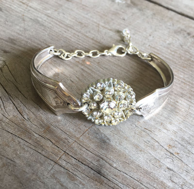 Upcycled silverware bracelet from two spoon handles and rhinestone button