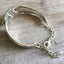 Upcycled silverware bracelet rhinestone button inside view