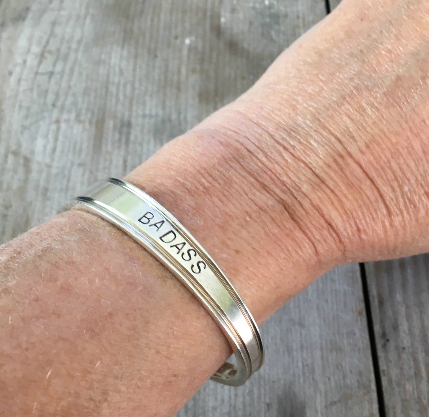 spoon cuff bracelet stamped badass shown on model wrist