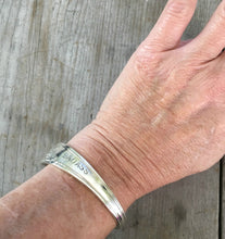 Stamped spoon cuff bracelet shown on model