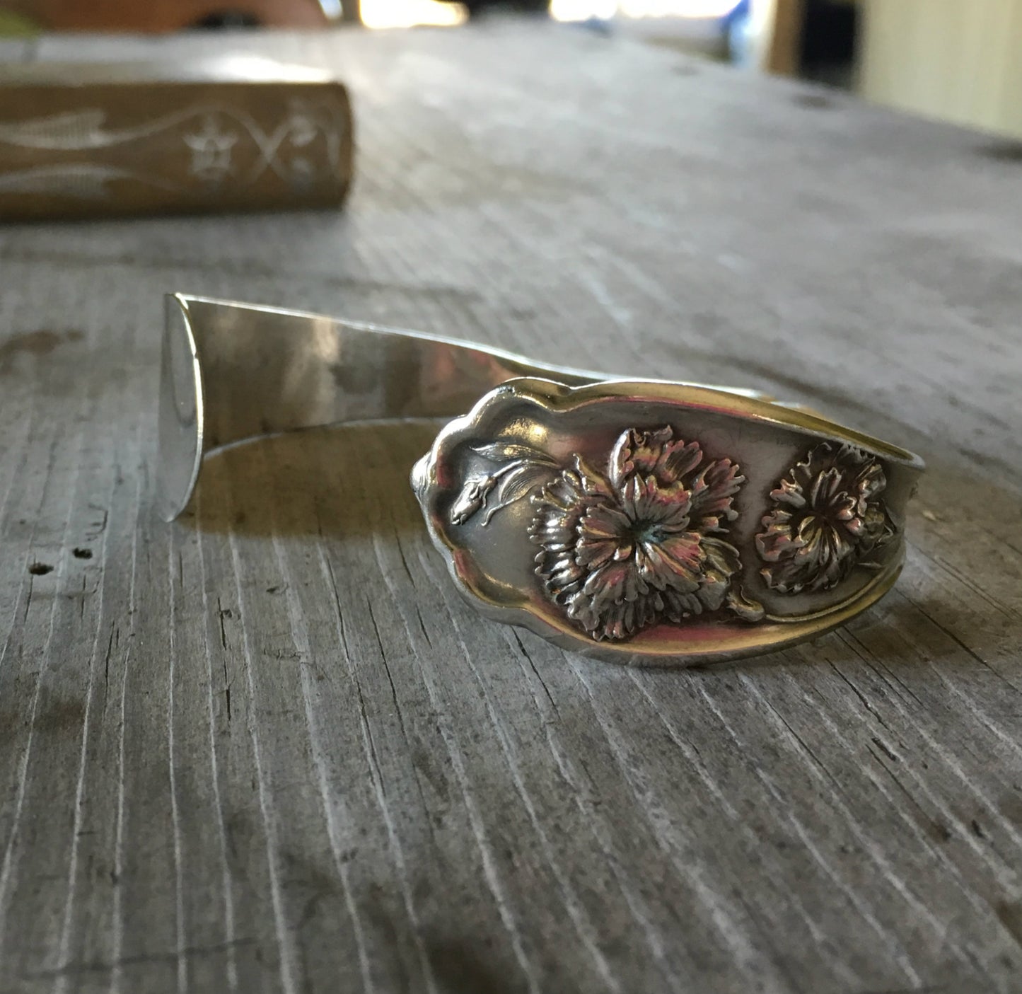 Carnation pattern silverplate spoon cuff bracelet close up - handcrafted from upcycled vintage silverware - Laughing Frog Studio

