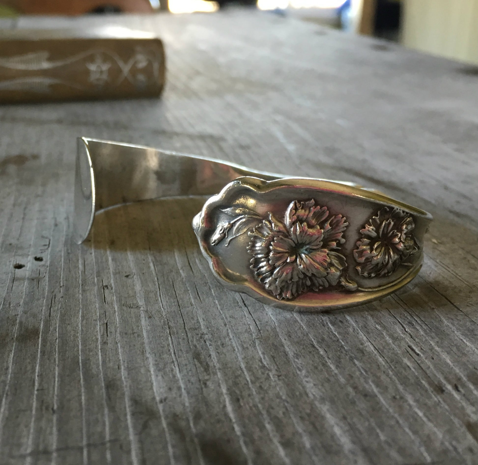 Carnation pattern silverplate spoon cuff bracelet close up - handcrafted from upcycled vintage silverware - Laughing Frog Studio

