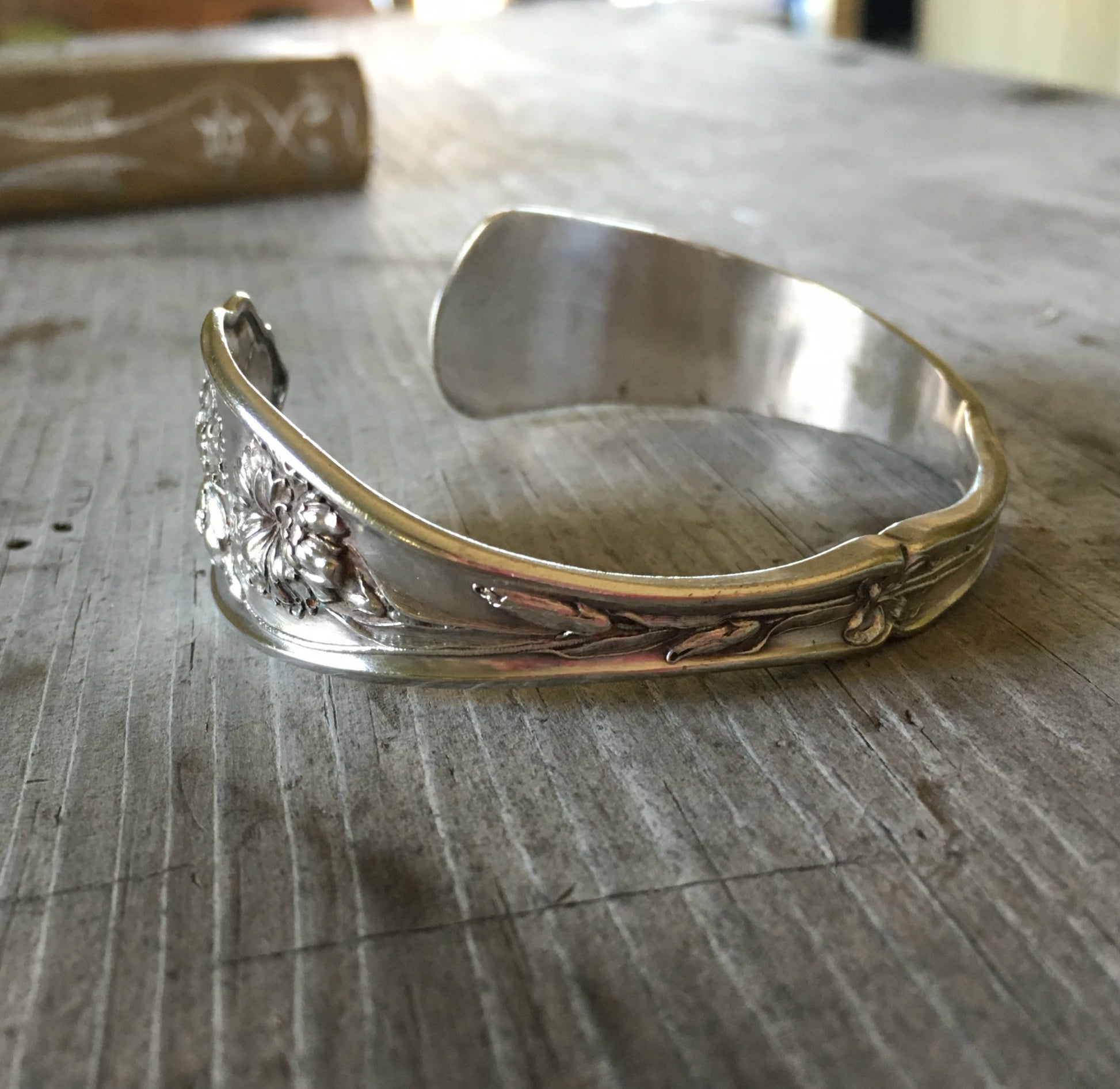Carnation pattern spoon cuff bracelet side view showing floral detail - handcrafted from upcycled vintage silverware - Laughing Frog Studio
