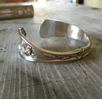 Carnation pattern spoon cuff bracelet side view showing floral detail - handcrafted from upcycled vintage silverware - Laughing Frog Studio