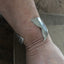 Mermaid Soul Cuff bracelet shown on model wrist 