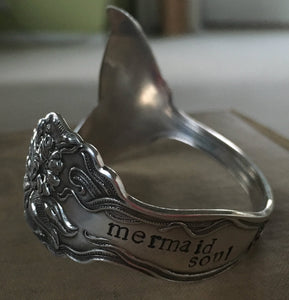 Closeup of the handstamping on the mermaid soul spoon cuff bracelet