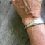 Handmade Spoon Cuff Bracelet from upcycled antique spoon shown on model