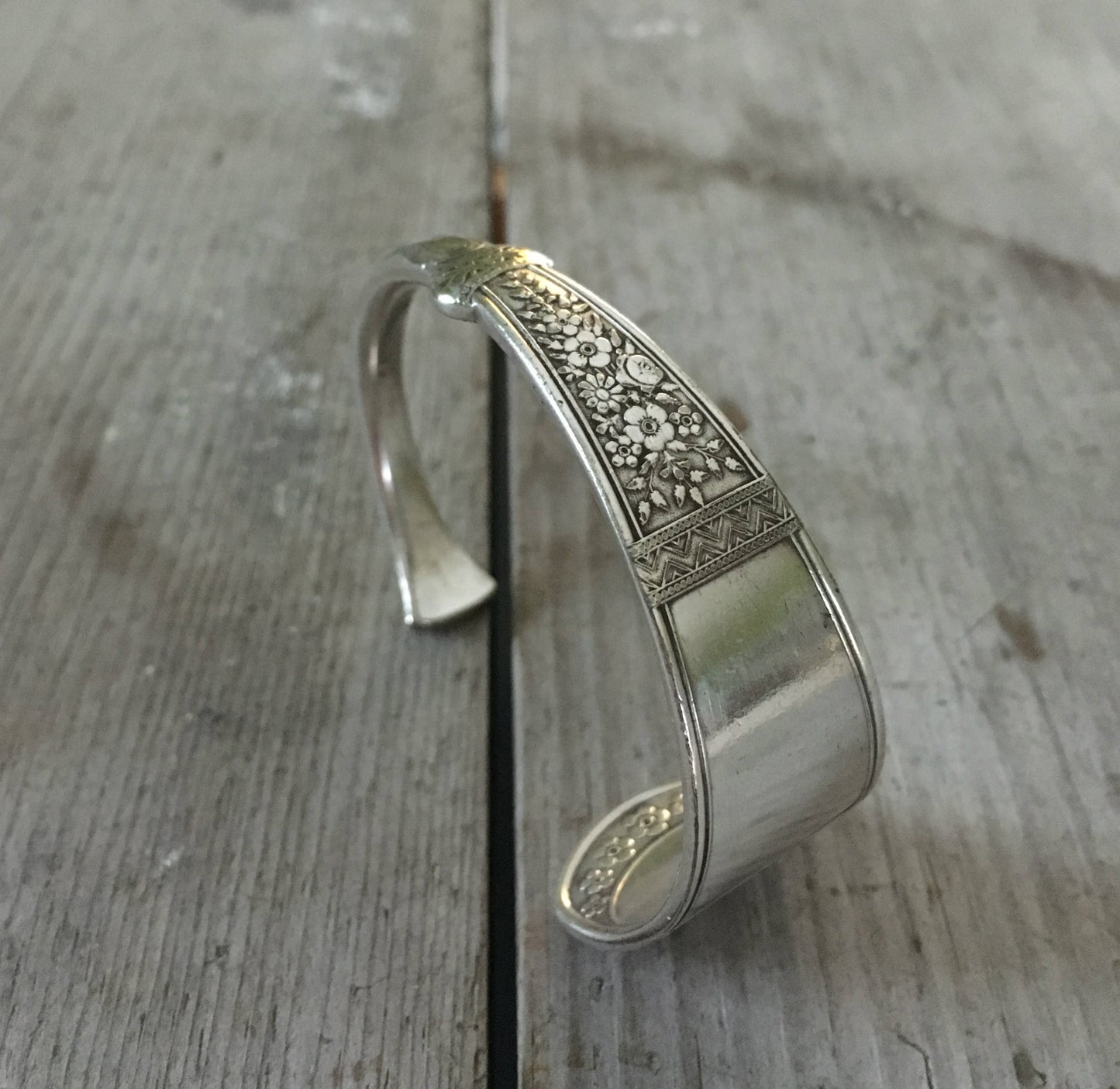Rogers and Brothers Westminster pattern spoon cuff bracelet standing upright showing Victorian detail - handcrafted from upcycled vintage silverware - Laughing Frog Studio