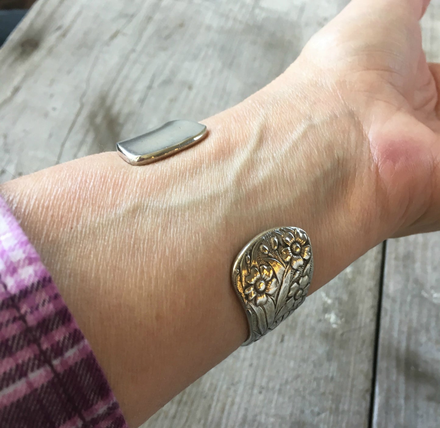 Close up detail of spoon cuff bracelet with flowers