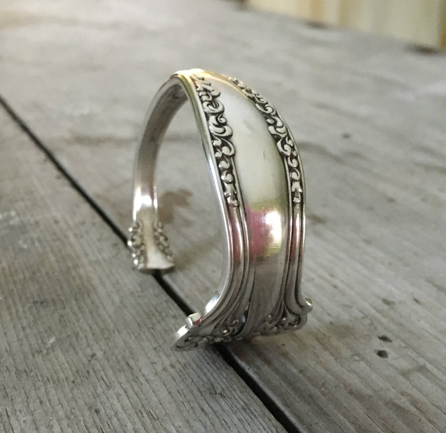 Ornate Avon Spoon Cuff bracelet shown standing highlight all the ornate details