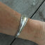 1847 Rogers Avon Spoon made into a cuff bracelet shown on model's arm from the top