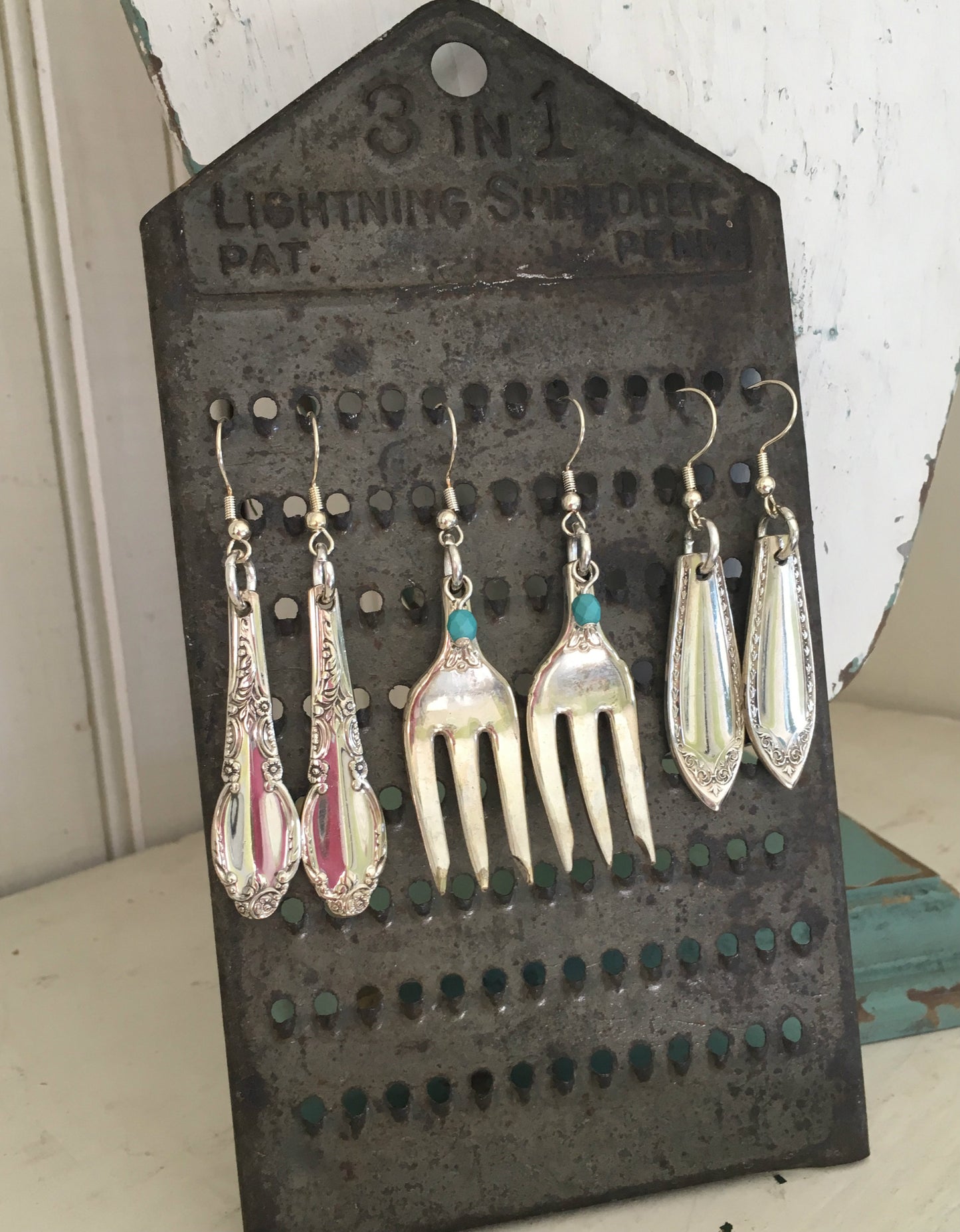 Sheraton Spoon Earrings Shown on Cheese Grater Display
