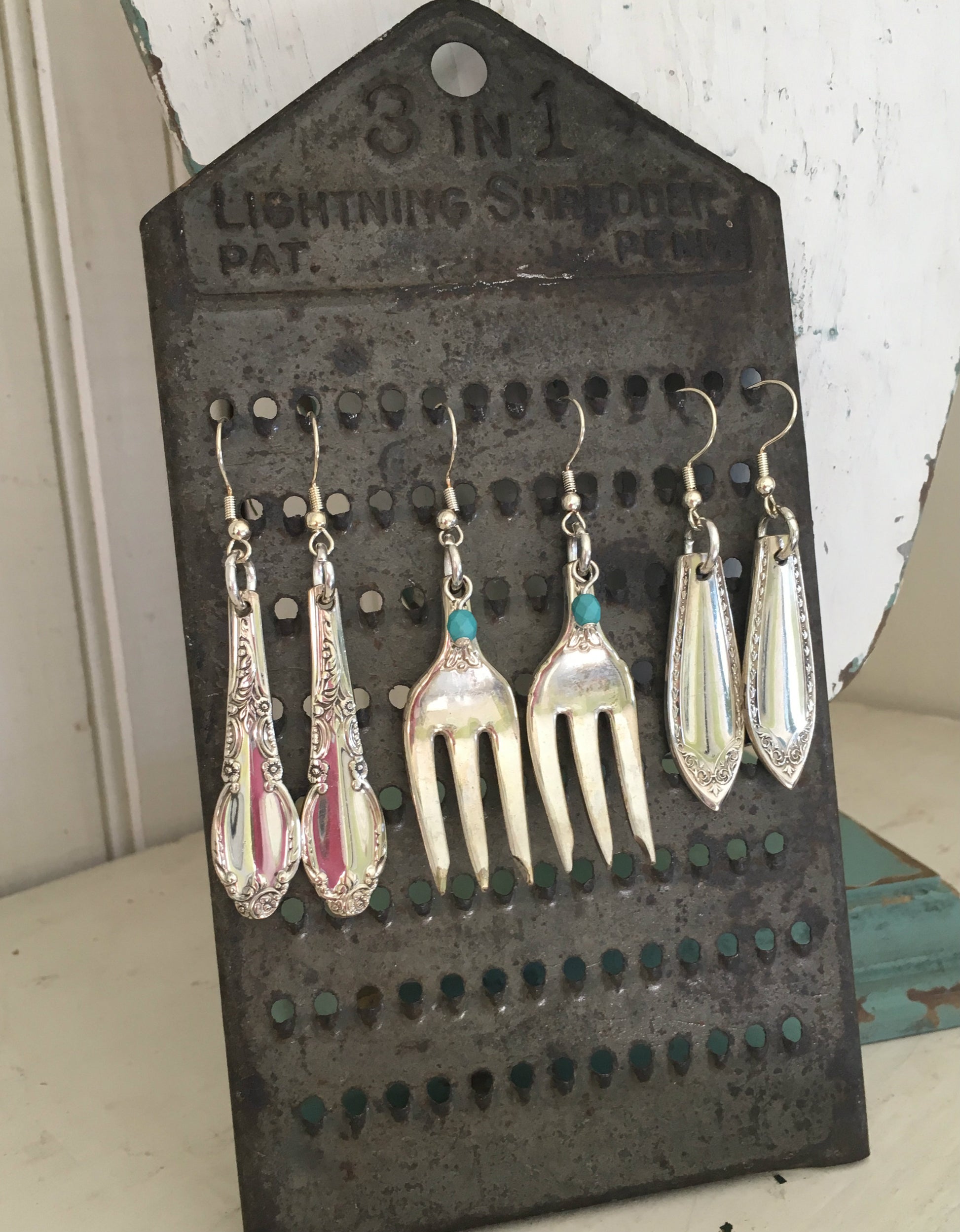 Sheraton Spoon Earrings Shown on Cheese Grater Display