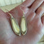 Spoon Handle Earrings In Sheraton Pattern Shown in hand for size scale