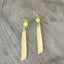 Earrings made from spoon handles in south seas pattern with chartreuse green bead