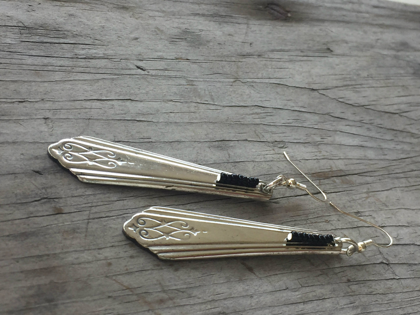 Side view of Art Deco silverware handle earrings