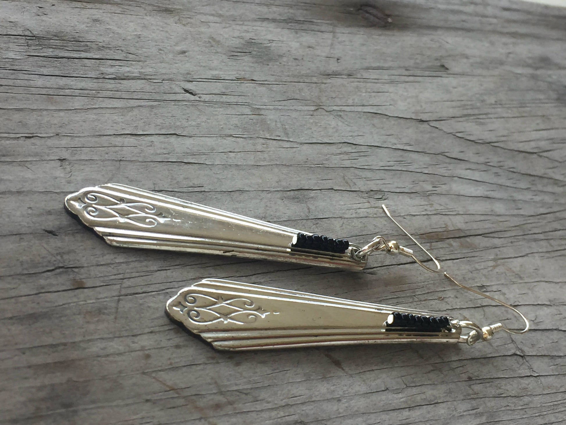 Side view of Art Deco silverware handle earrings