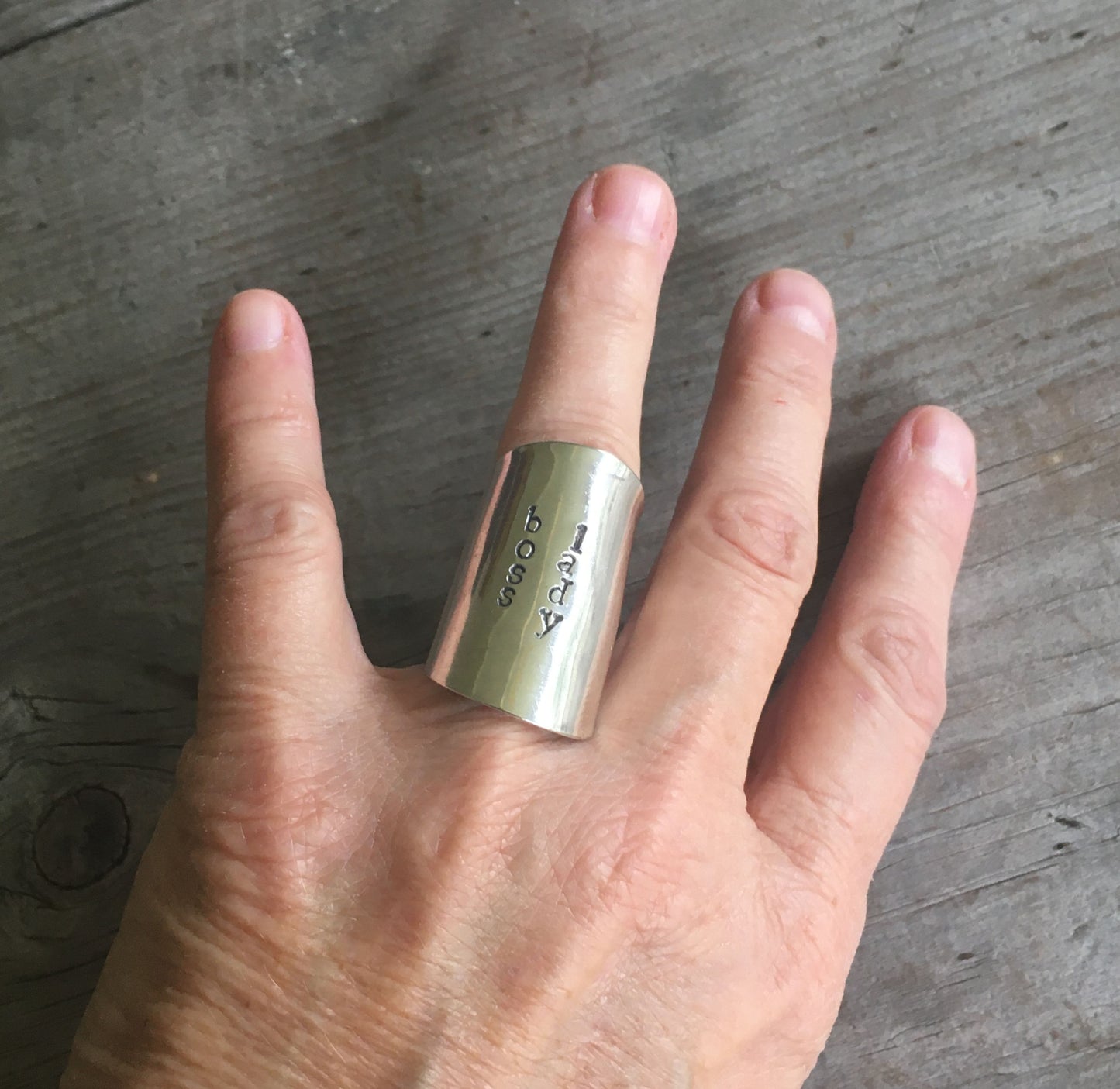 Boss Lady spoon cuff ring shown on hand - empowering handcrafted silverware jewelry