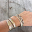 Handstamped spoon cuff bracelet Persist shown on model wrist