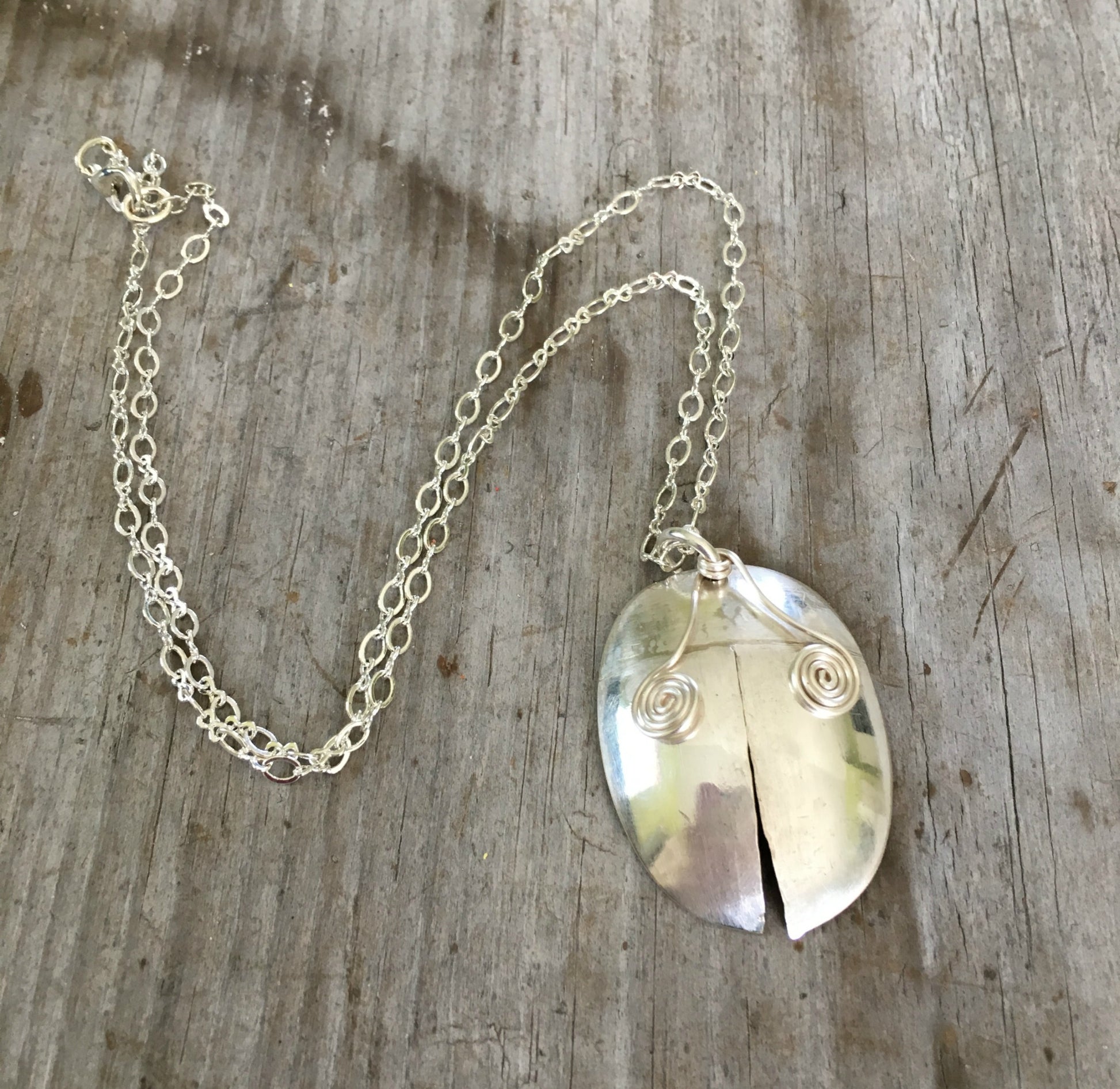 Handmade one of a kind spoon necklace shaped like a ladybug