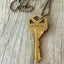 Closeup of Stamped Key Necklace LOYALTY