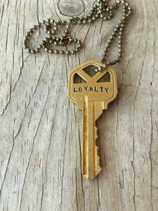 Closeup of Stamped Key Necklace LOYALTY