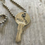 close up of Hand Stamped recycled Key Necklace WILD CHILD with vintage ball chain
