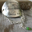 Stamped spoon bracelet with green cylinder millifiori bead