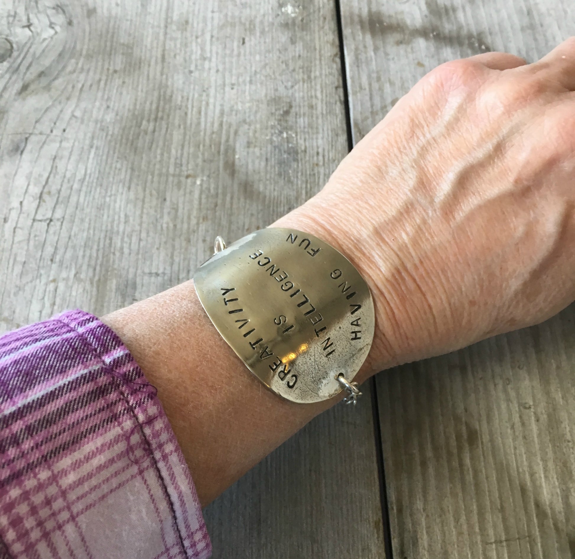 Creativity is Intelligence Having Fun Stamped Spoon Bracelet Shown on Model