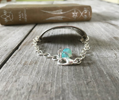 Side view of curve of spoon bracelet stamped if you stumble make it part of the dance